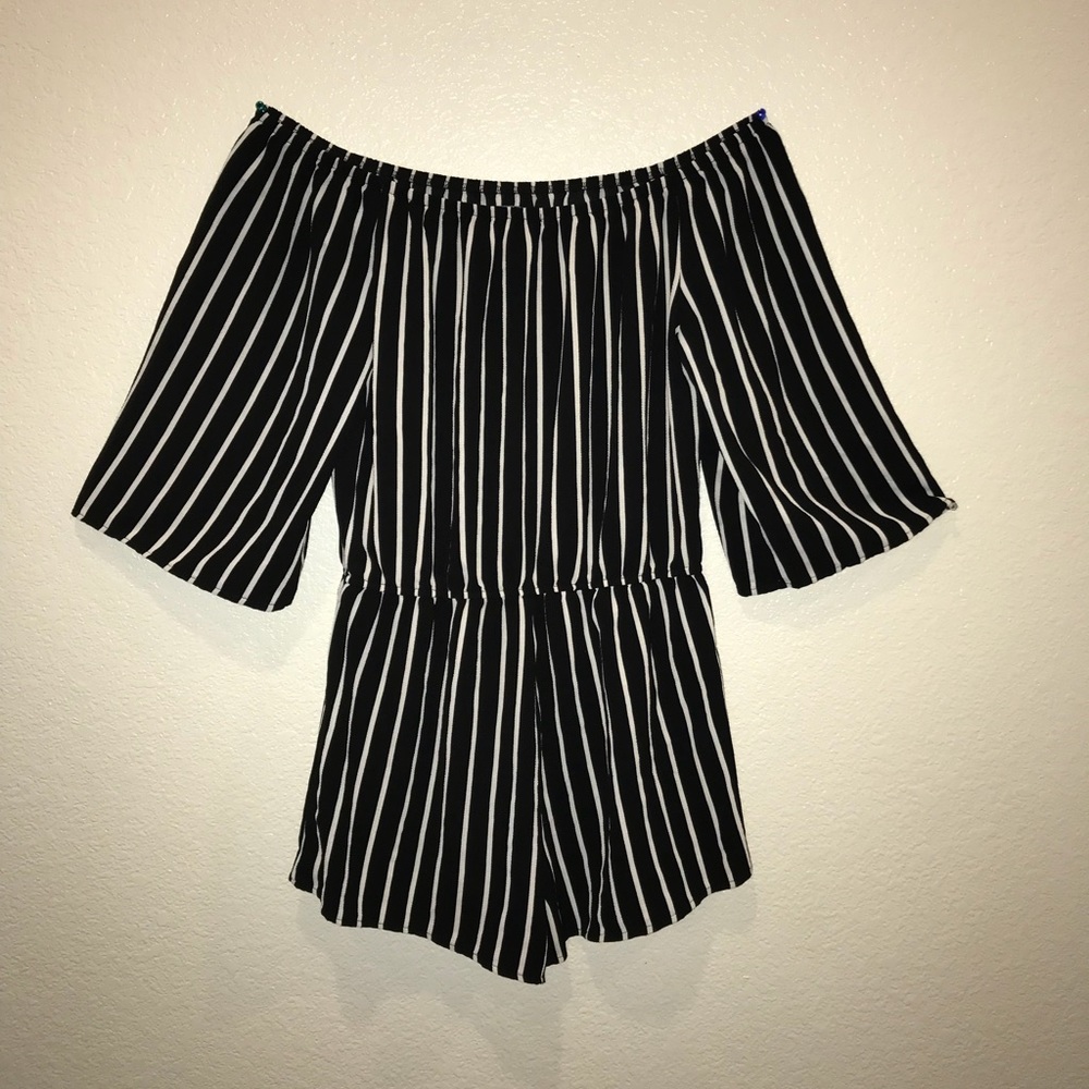black romper with vertical white stripes